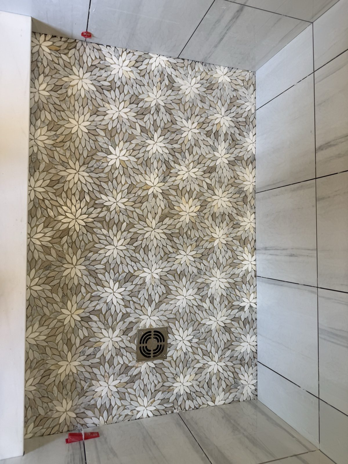 Star mosaic tile floor with large-format walls, installed by Top Notch, Webster MA